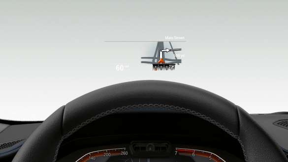BMW 3 Reeks Berline, Head-Up Display. Frontale close-up van het halve stuur en de voorruit van de BMW 3 Reeks Berline met Head-Up Display.