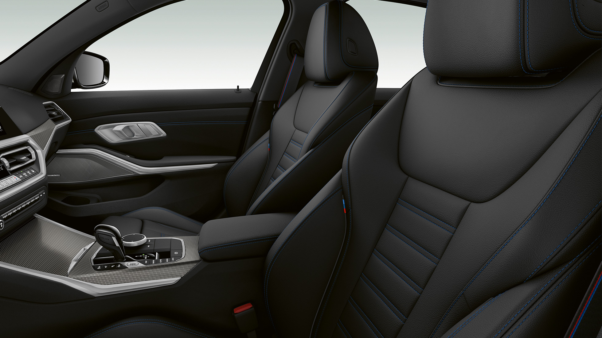 BMW 3 Reeks Berline, M340i xDrive voorzetels Zijdelingse close-up van de voorzetels van de BMW 3 Reeks M340i xDrive Berline.